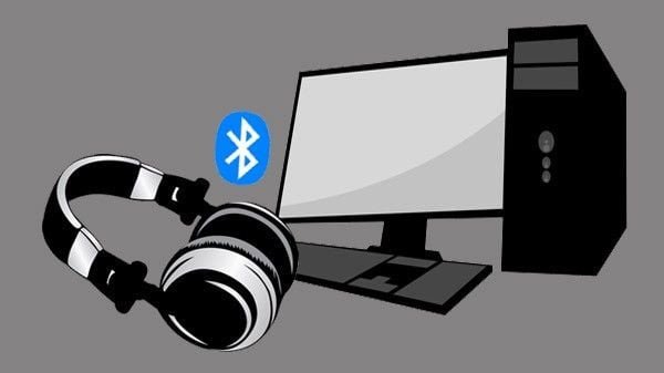 Hình ảnh minh họa một chiếc tai nghe bluetooth đang được kết nối không dây với máy tính xách tay
